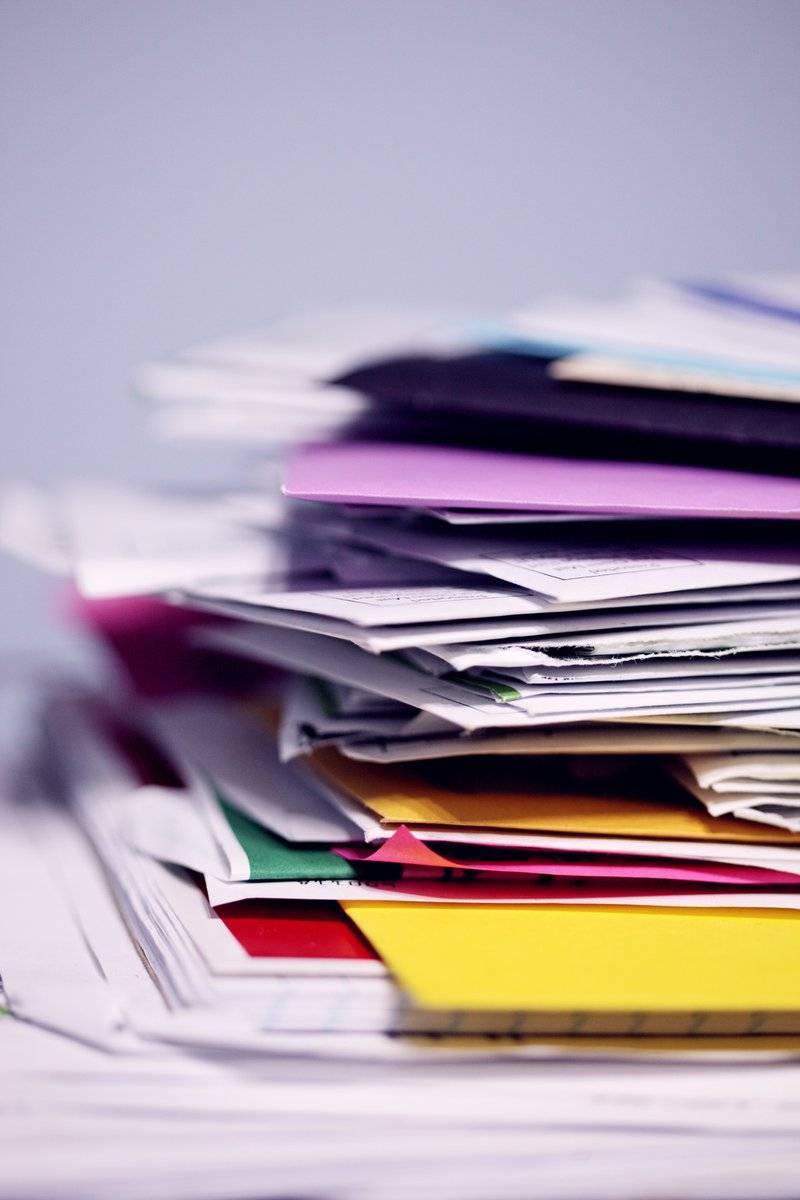 Pile of mail waiting to be sorted and shredded.